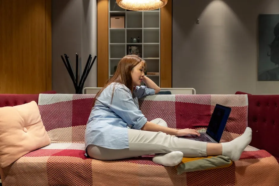A focused worker at a clean desk using a Pomodoro timer — single task open, phone face-down, deliberate workspace