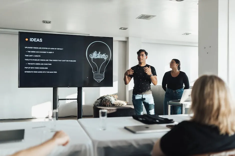 A remote worker on a video call in a home office in Singapore — laptop camera at eye level, notes visible, framed and well-lit for hybrid meetings