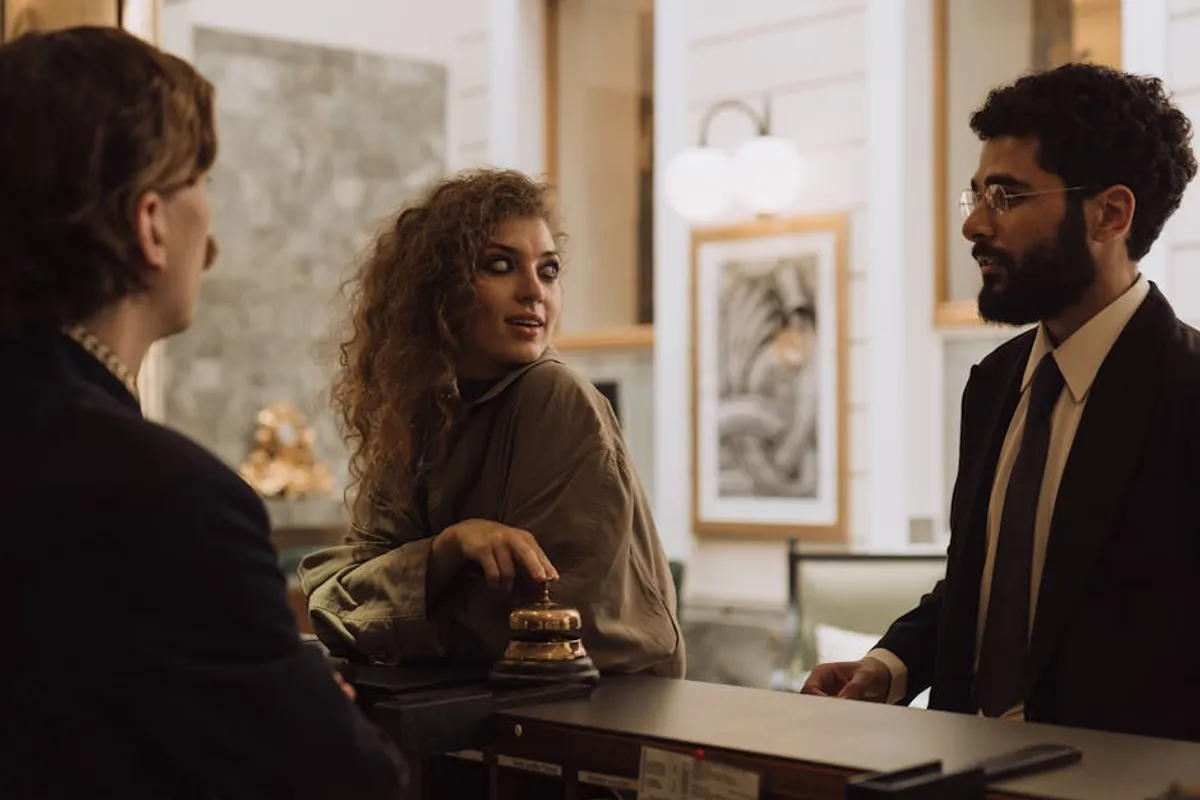A Singapore customer service professional and a once-frustrated customer in a calm, warmer follow-up conversation, suggesting recovered relationship